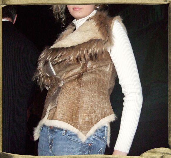 TARTAR Crocodile embossed Leather and fur vest trimmed in racoon.