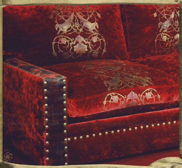 COEUR DE SULYEMAN on La Scala silk velvet on studded sofa.
